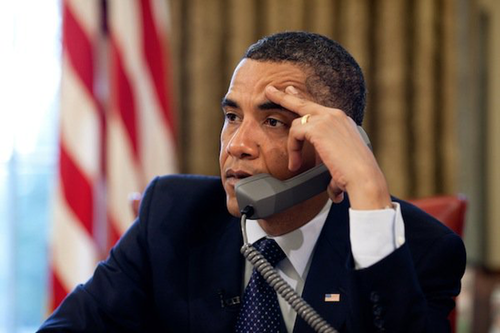 President Obama on the phone again, looking unhappy and stressed